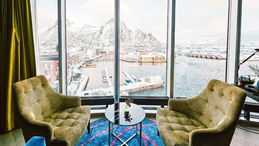 photo of sitting area looking out at snowcapped mountains in Lofoten Islands, Norway