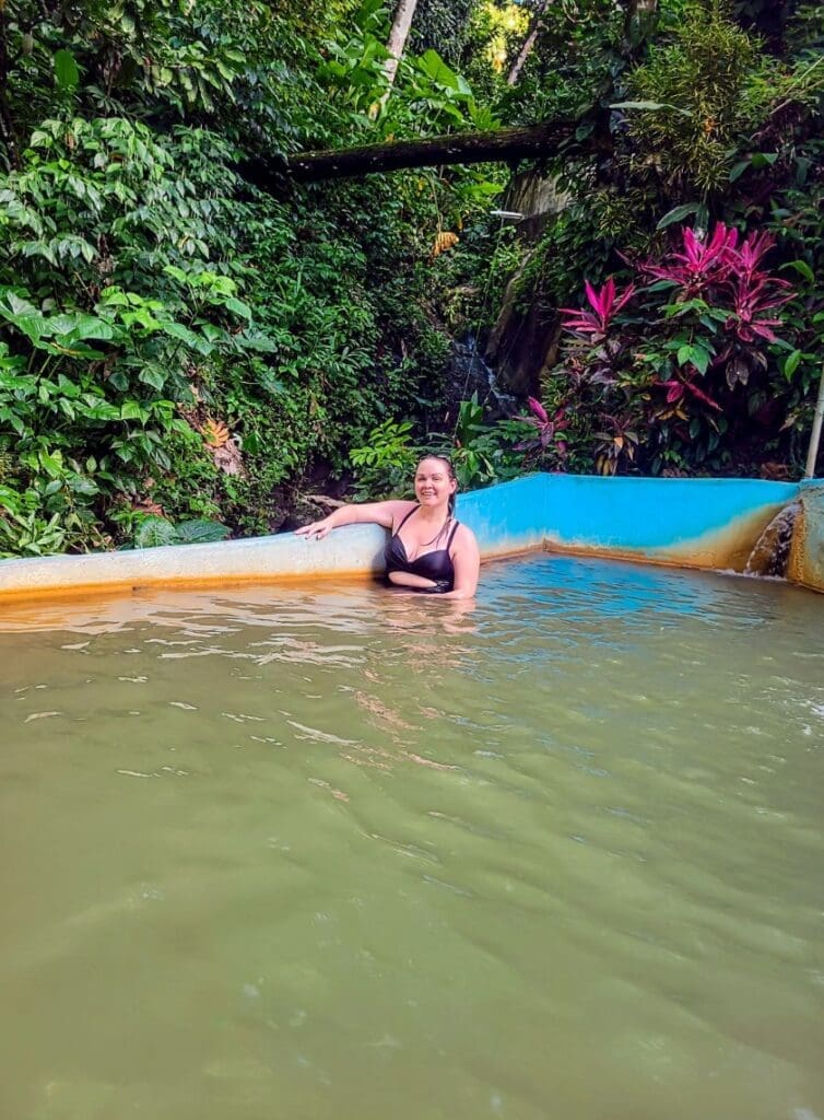 photo of woman smiling in mineral bath in St. Lucia