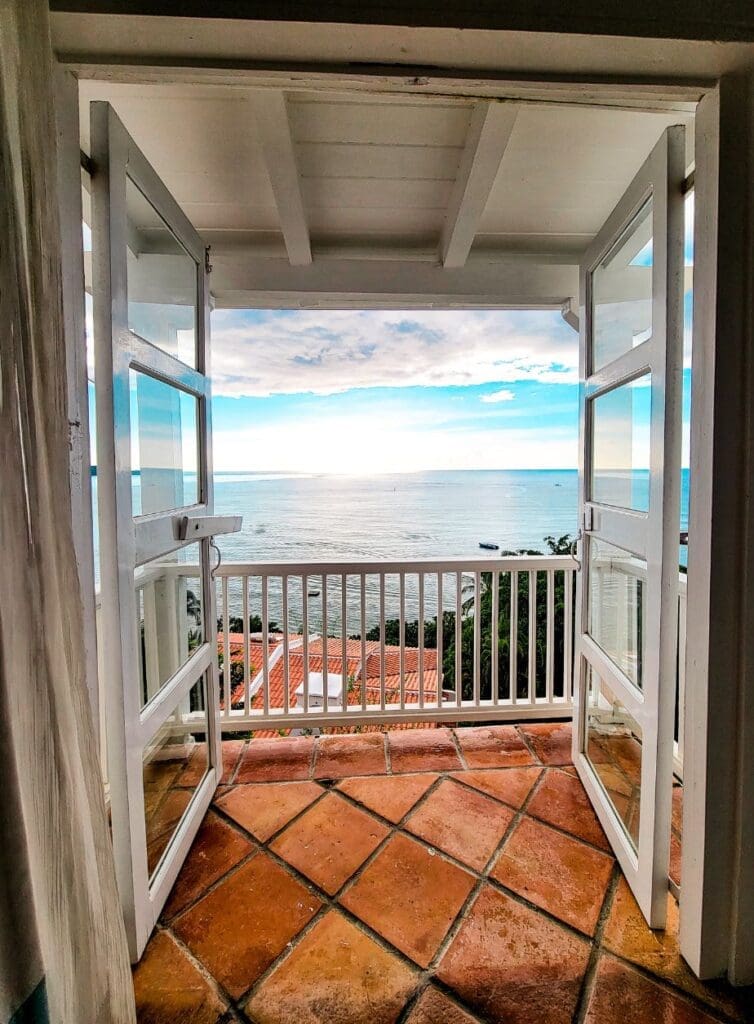 photo of view from french doors with ocean in the distance in St. Lucia 