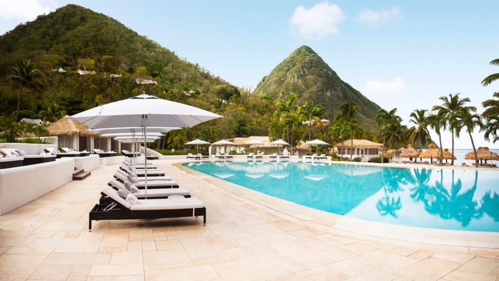 view of pool with the Pitons in the background at Sugar Beach Resort in St. Lucia