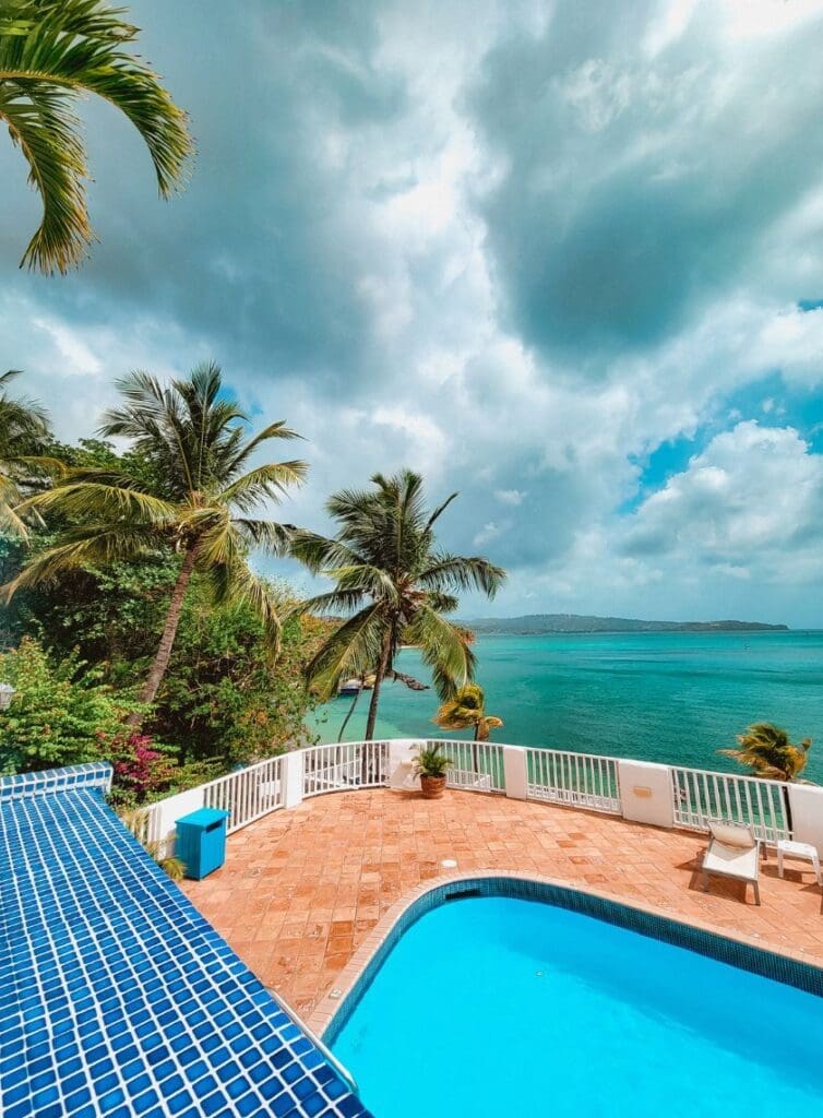 photo of pool with storm clouds in the distance in St. Lucia