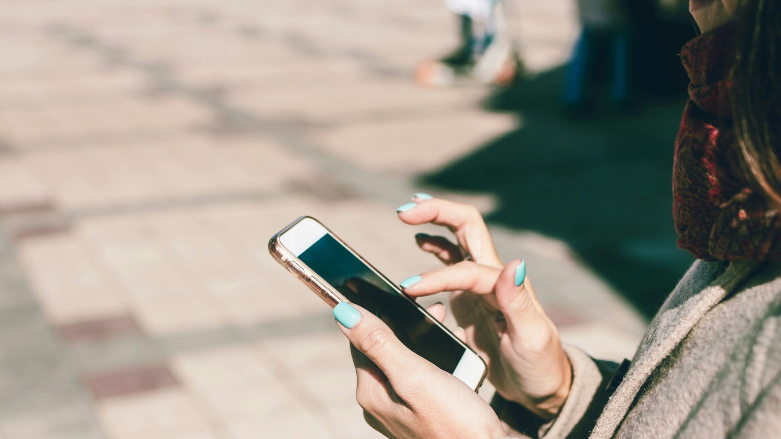 photo of woman scrolling on her phone