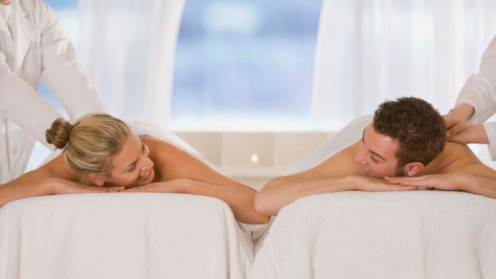 photo of couple on tables getting a massage