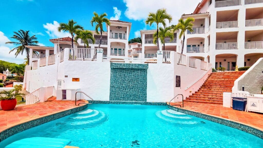 pool at Windjammer Landing looking up at Main Sail suites