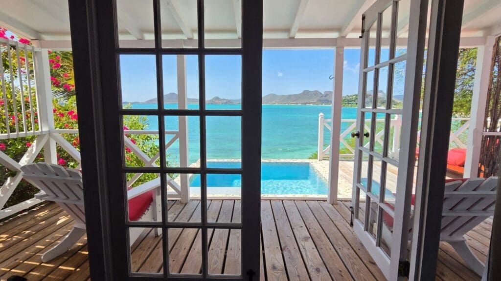 photo of plunge pool, views, and deck from french doors
