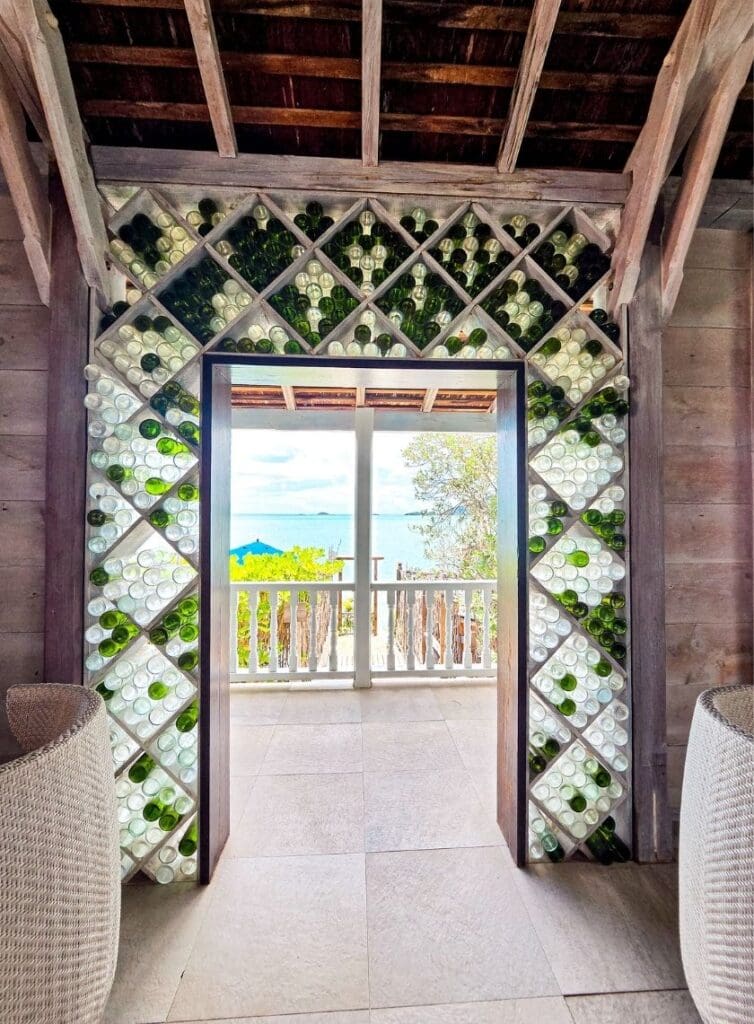 photo of bottles lining door entryway at bar