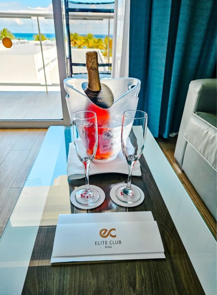 photo of welcome champagne, with glasses, and a note at Hotel Riu