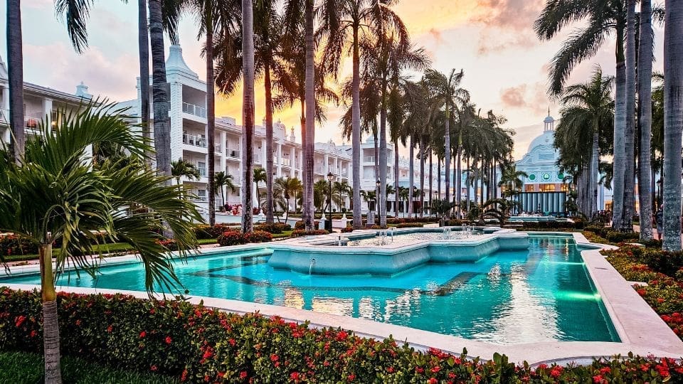 photo of fountain and garden at Hotel Riu Palace in Riviera Maya at golden hour