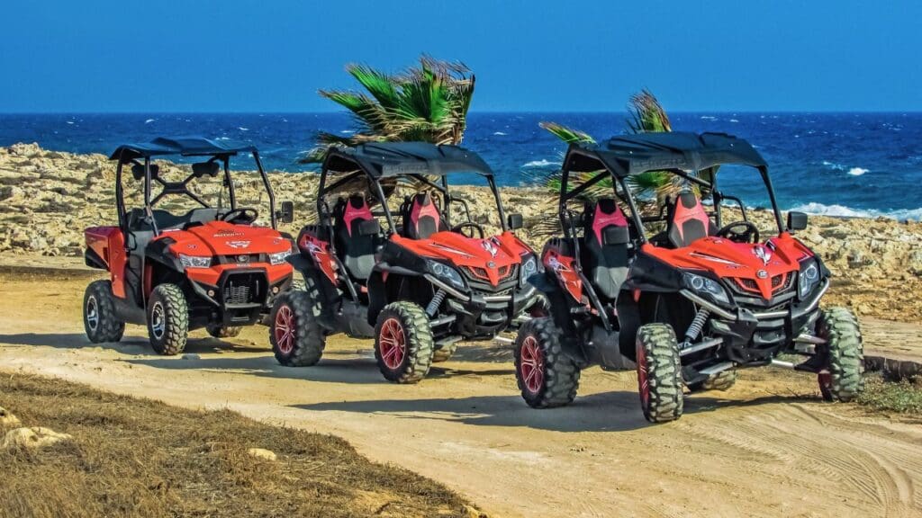 photo of buggies parked by beach