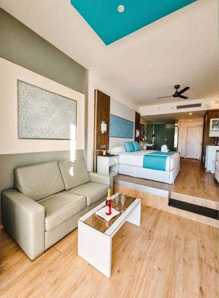 photo of seating area and bed at Hotel Riu in Playa del Carmen