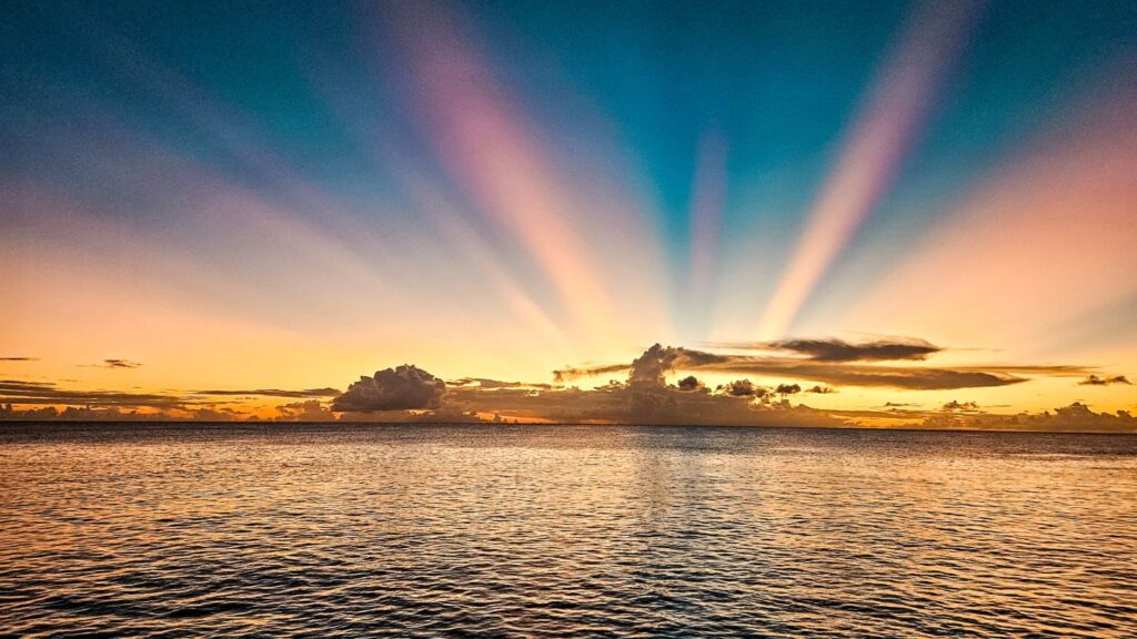 photo of sunset over sea in St. Lucia from catamaran cruise