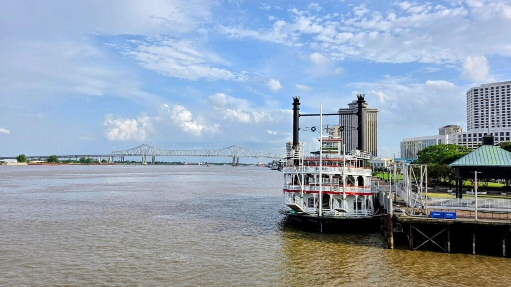 photo of steamboat and bridge over Mississippi River 