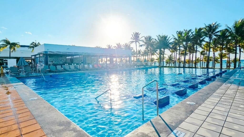 photo of sun loungers in pool and pool bar at Hotel Riu Palace