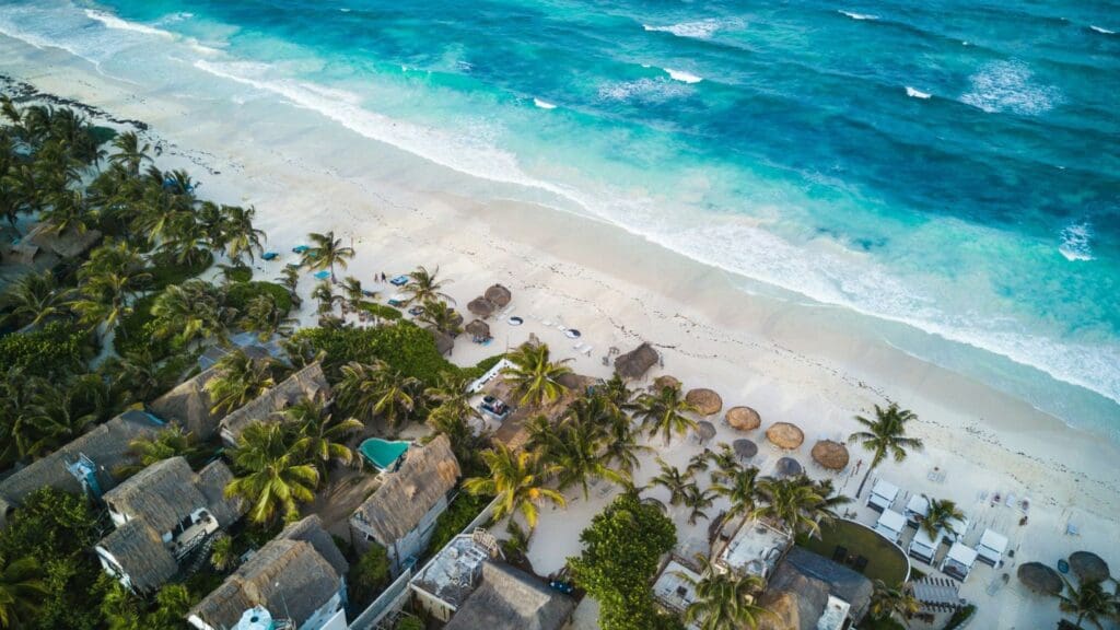 photo of beach and houses at Tulum in Mexico