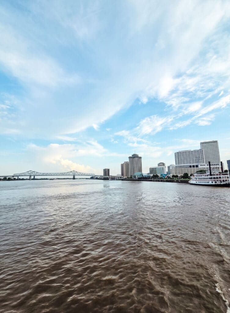 photo of Mississippi River with city in the background and bridge