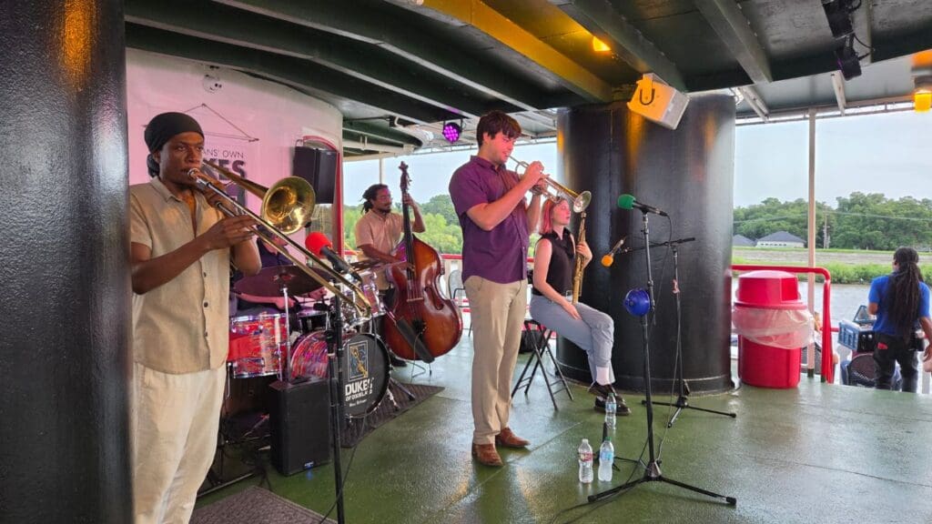 photo of jazz musicians playing on steamboat cruise down the Mississippi