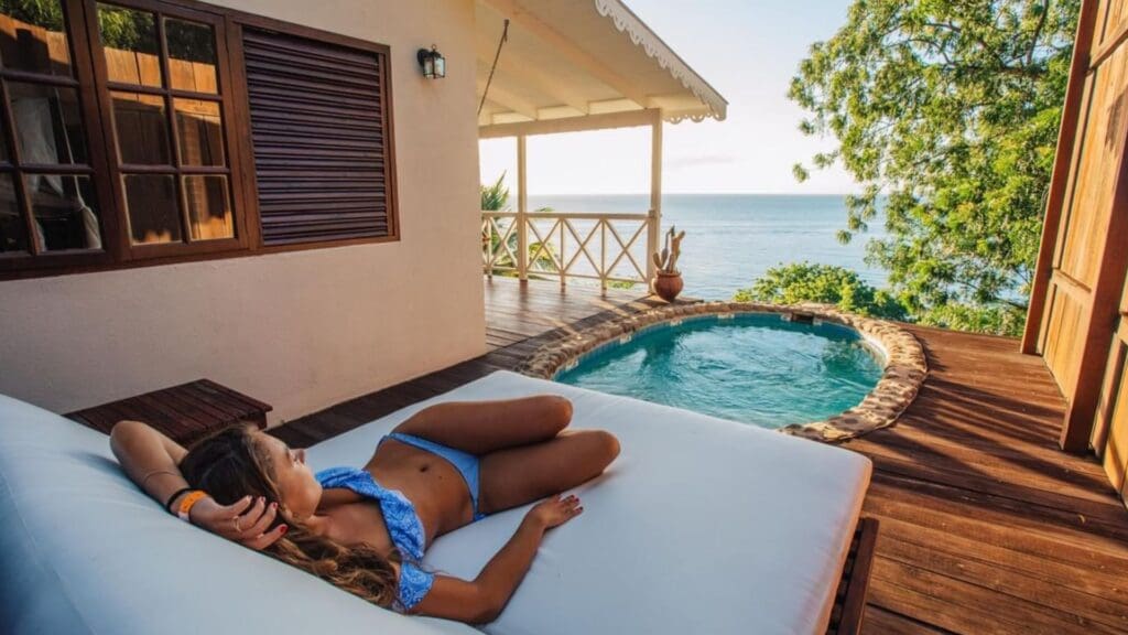 photo of woman lounging by private plunge pool at Ti Kaye Resort
