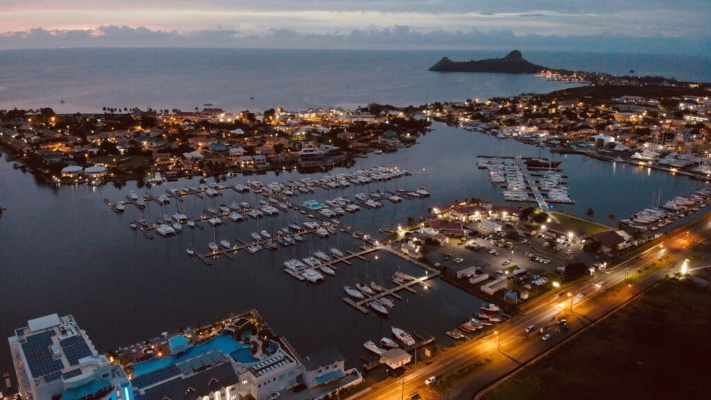 photo of Rodney Bay Marina at night with Pigeon Island in the distance