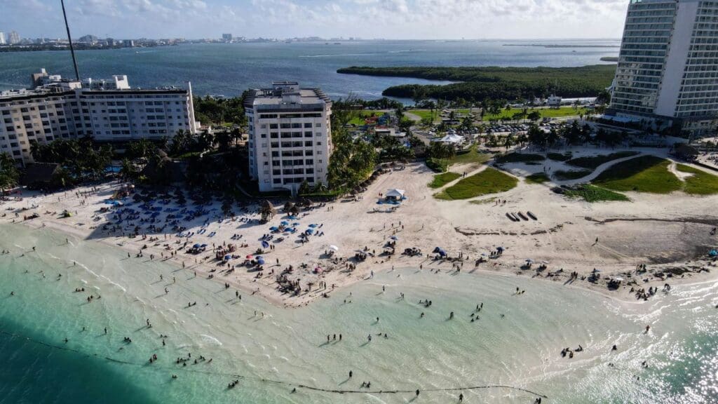aerial shot of Cancun resorts, beaches, and people