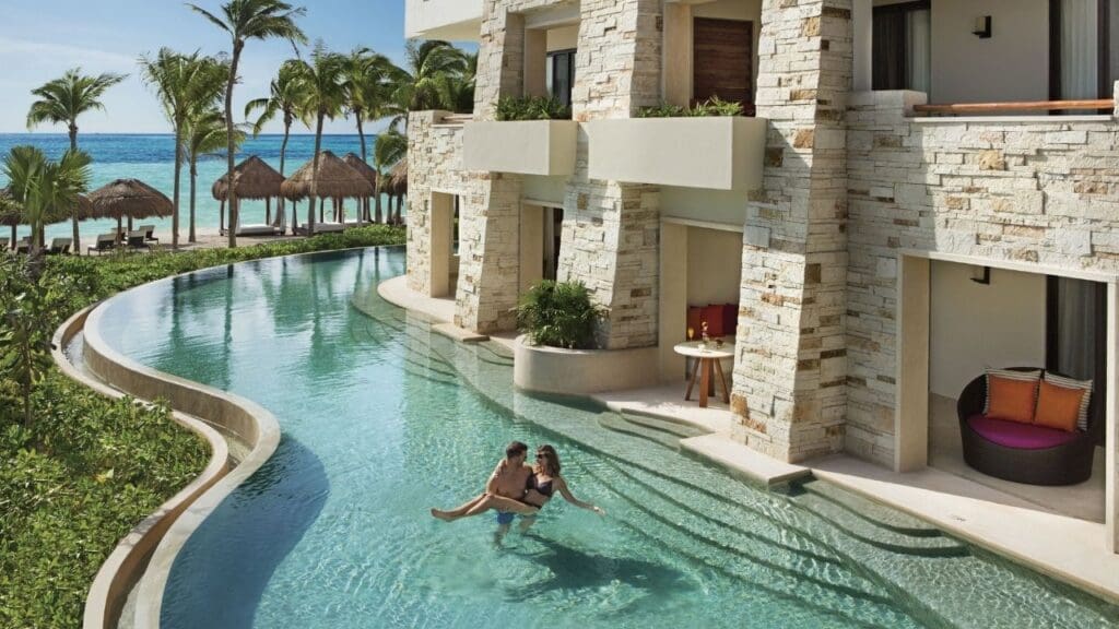 photo of couple relaxing in pool at Secrets Akumal Riviera Maya