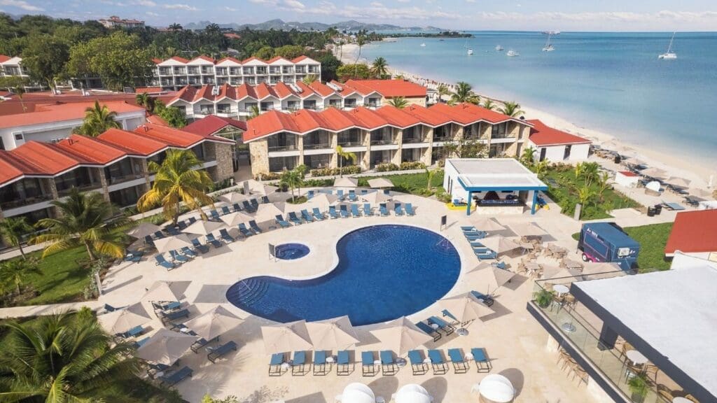aerial photo of pool, beach, and accommodations at Royalton CHIC Antigua. 