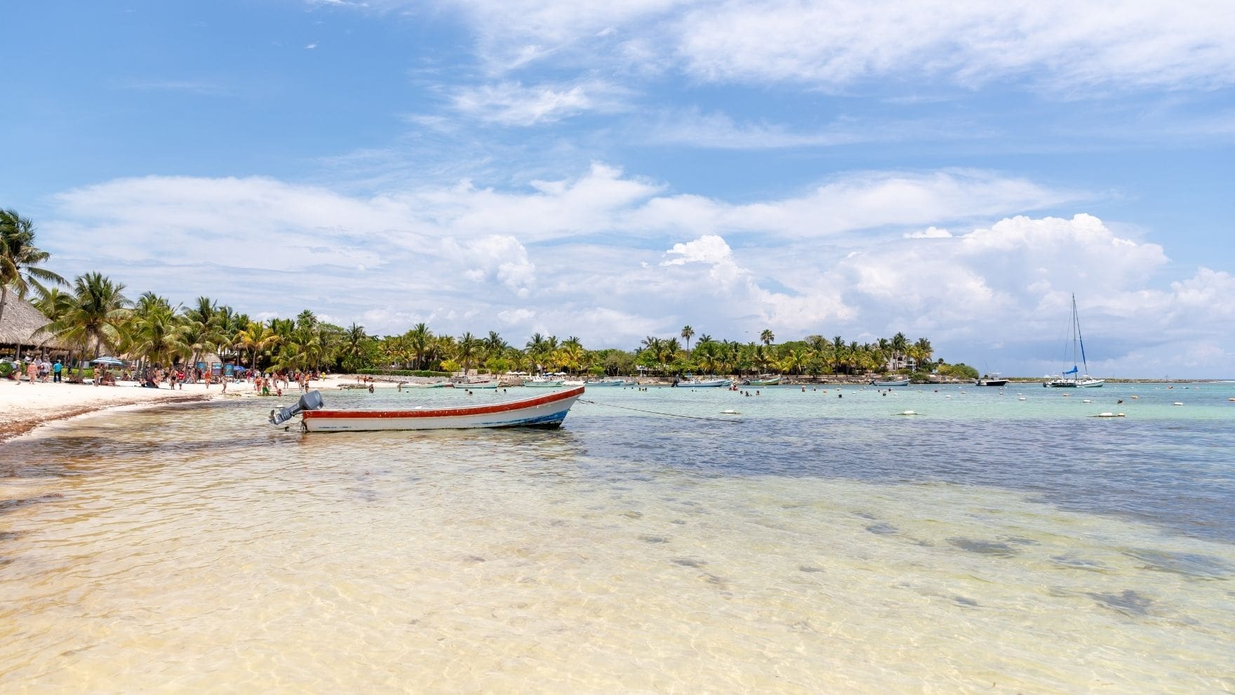 photo of boat parked along the beach at Akumal, Mexico