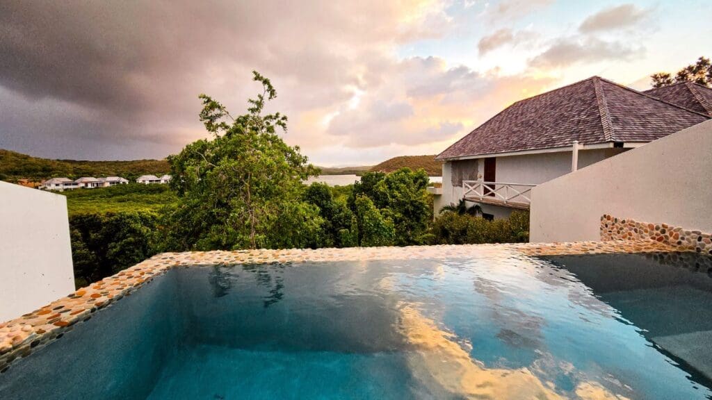photo of storm rolling in and sun setting in Antigua at Nonsuch Bay