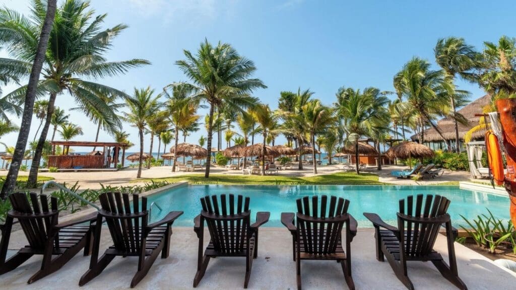 lounge chairs and pool at Akumal Bay Beach & Spa Resort