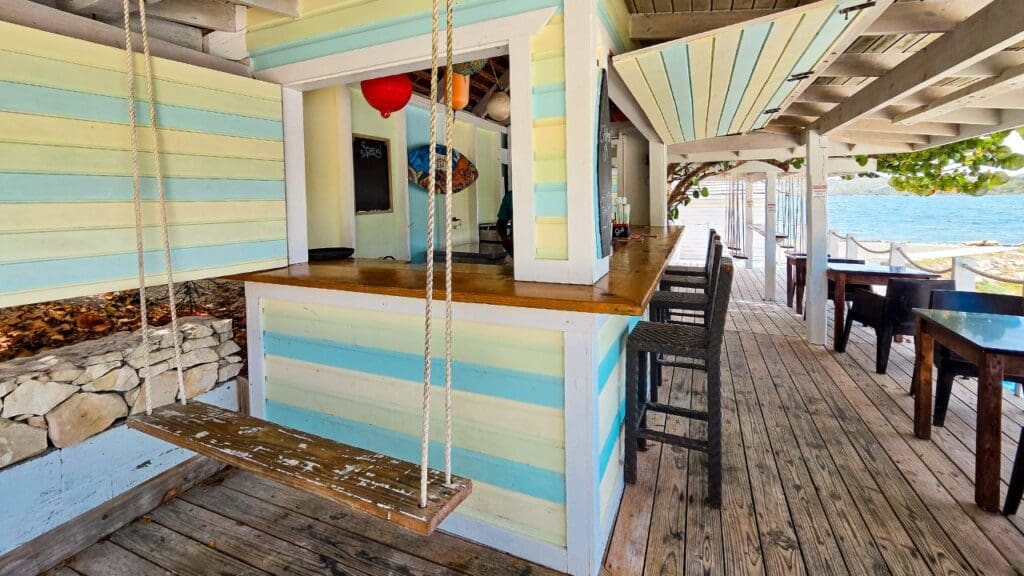 photo of bar, sitting area, and beach at Sea Grape Beach Bar in Antigua