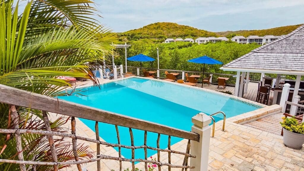 photo of pool, bar, and lounge chairs at The Escape at Nonsuch Bay